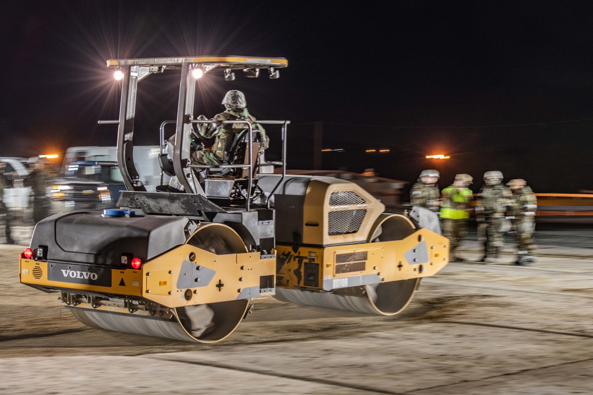 An Airman on a roller speeds over gravel