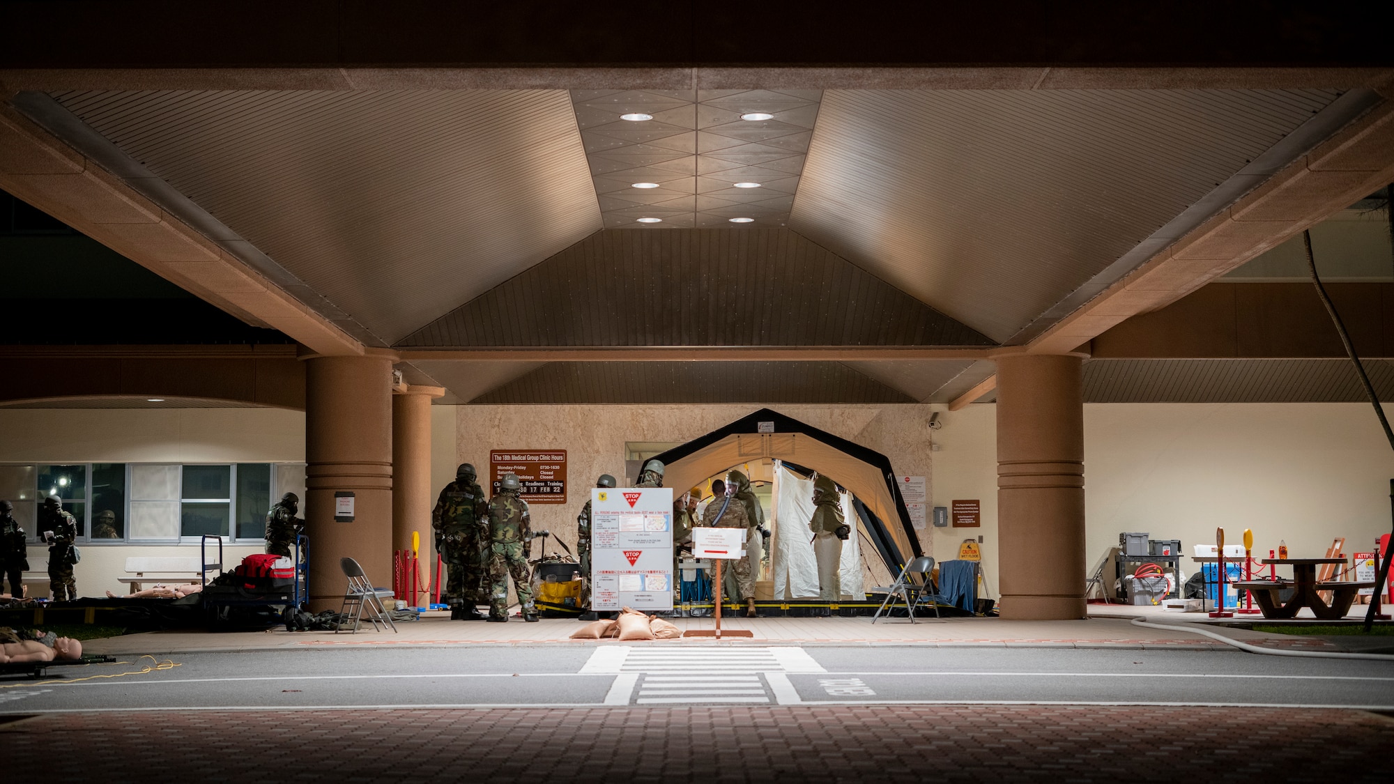 Airmen simulate patient decontamination during training.
