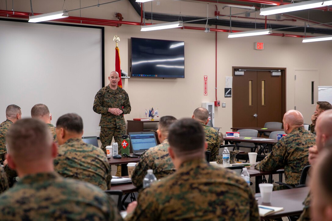 U.S. Marine Corps Sgt. Maj. Troy E. Black, the 19th Sergeant Major of the Marine Corps, speaks to Marines attending the Ground Combat Element Operations (GCE) Chief Symposium at Marine Corps Base Quantico, Virginia, Feb 28, 2022. The Sergeant Major of the Marine Corps spoke at the symposium to share his insight on talent management and retention of infantry Marines. The ground combat element operations chiefs symposium is a single forum for discussing, developing and consolidating common GCE priorities in preparation for presentation to the Marine Division commanders at the upcoming annual GCE conference. (U.S. Marine Corps photo by Staff Sgt. Victoria Ross)