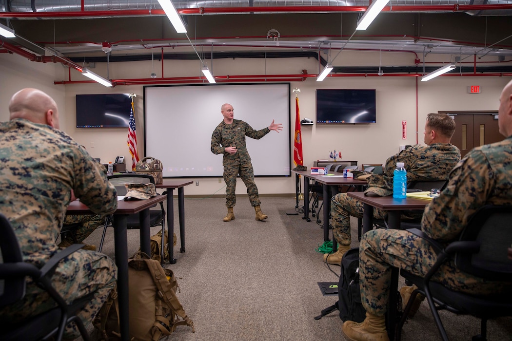 U.S. Marine Corps Sgt. Maj. Troy E. Black, the 19th Sergeant Major of the Marine Corps, speaks to Marines attending the Ground Combat Element Operations (GCE) Chief Symposium at Marine Corps Base Quantico, Virginia, Feb 28, 2022. The Sergeant Major of the Marine Corps spoke at the symposium to share his insight on talent management and retention of infantry Marines. The ground combat element operations chiefs symposium is a single forum for discussing, developing and consolidating common GCE priorities in preparation for presentation to the Marine Division commanders at the upcoming annual GCE conference. (U.S. Marine Corps photo by Staff Sgt. Victoria Ross)