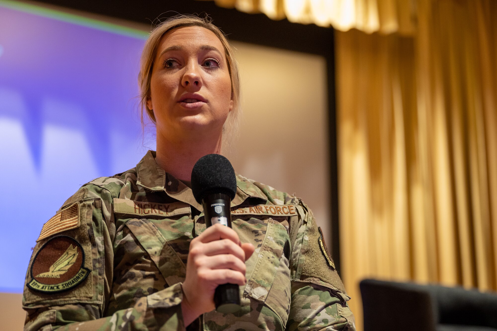 1st. Lt. Alexis Hickey, 89th Attack Squadron chief of the MQ-9 mission planning cell, emcees at the first ever Women’s Conference at Ellsworth Air Force Base, S.D., March 2, 2022.