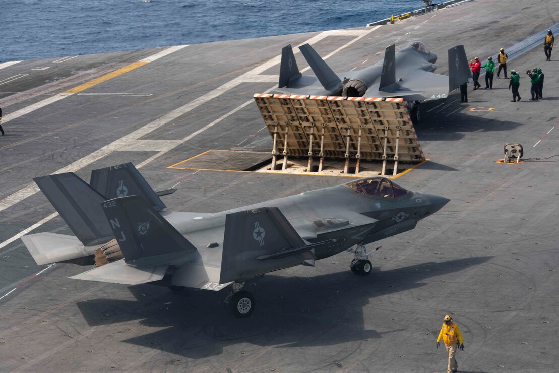 An F-35C Lightning II, from the "Rough Raiders" of Strike Fighter Squadron (VFA) 125, taxis across the flight deck of the aircraft carrier USS Nimitz (CVN 68).
