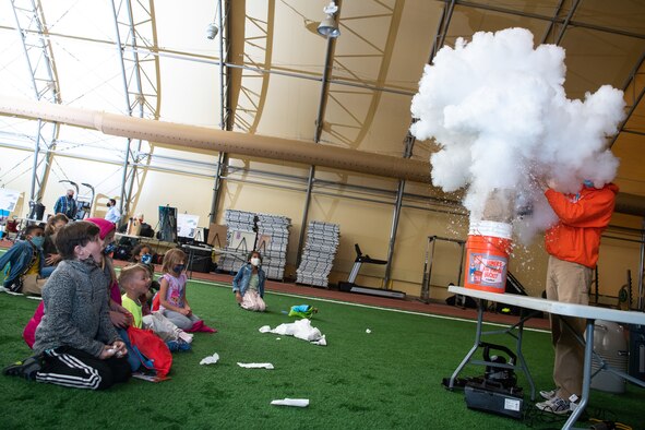 kids watching science experiment