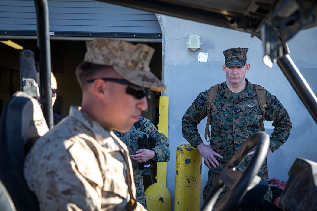 U.S. Marine Corps Sgt. Maj. Troy E. Black, the 19th Sergeant Major of the Marine Corps, observes Cpl. Austin Schubert, a motor transport Marine, explain the basic operating requirements for the Polaris Razor all-terrain vehicle at Marine Corps Air Ground Combat Center, Twentynine Palms, California, March 2, 2022. The Sergeant Major of the Marine Corps attended the Polaris Razor licensing course to maximize freedom of movement in the training areas surrounding the station. The course is designed to introduce Marines to the all-terrain vehicle, and familiarize them to its capabilities and safety considerations. (U.S. Marine Corps photo by Staff Sgt. Victoria Ross)
