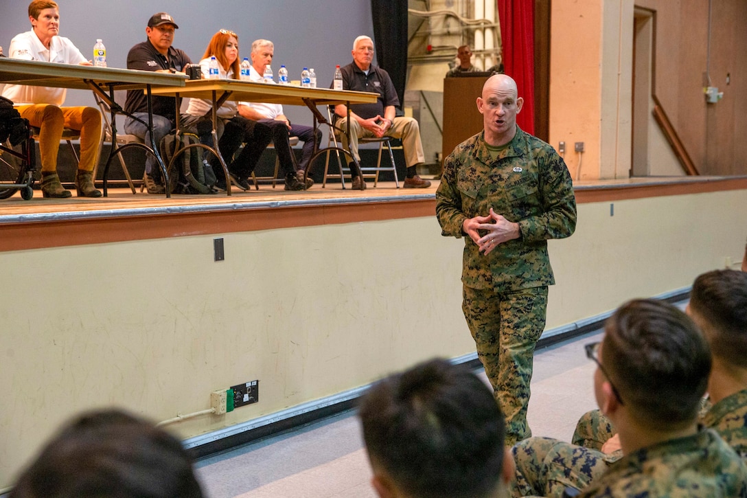 U.S. Marine Corps Sgt. Maj. Troy E. Black, the 19th Sergeant Major of the Marine Corps, speaks to Marines with 7th Marine Regiment, at a Troops First town hall at Marine Corps Air Ground Combat Center, Twentynine Palms, California, March 2, 2022. The Sergeant Major of the Marine Corps spoke to Marines about talent management, force design, human performance and the importance of staying connected. The Troops First Foundation was created to develop, operate and support wellness, quality of life and event-based initiatives for post-9/11 combat-injured Warriors. (U.S. Marine Corps photo by Staff Sgt. Victoria Ross)