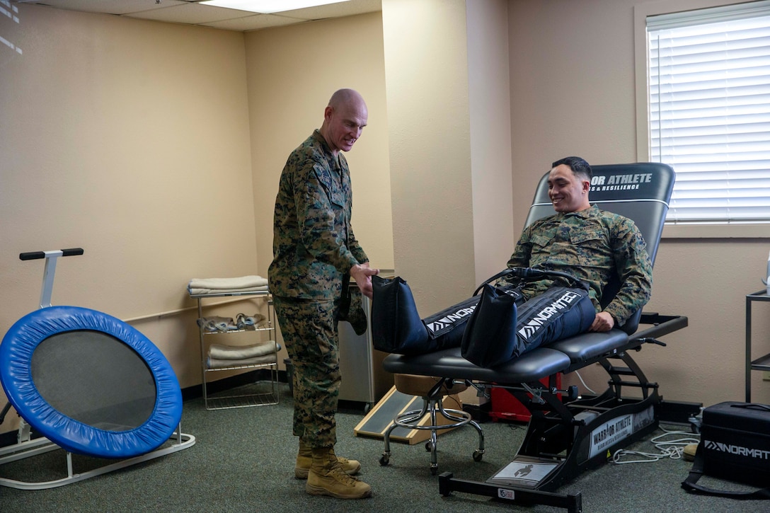 U.S. Marine Corps Sgt. Maj. Troy E. Black, the 19th Sergeant Major of the Marine Corps, greets Staff Sgt. Russell Bolton, an air control training squadron instructor, at Marine Corps Air Ground Combat Center, Twentynine Palms, California, March 2, 2022. The Sergeant Major of the Marine Corps toured the Warrior Athlete Readiness and Resilience (WARR) Center to review the capabilities and benefits available to Marines as a potential template to introduce at all Marine Corps installations. The WARR program is designed to enhance operational fitness levels and optimize combat readiness and resiliency for the active duty and reservist Marine. They include a methodology for understanding, assessing, programming, and maintaining Service members’ well-being and sustaining their ability to carry out missions. (U.S. Marine Corps photo by Staff Sgt. Victoria Ross)