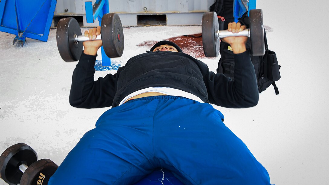 Airman works out during winter weather event February 24, 2022