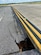 A sinkhole, a depression in the ground caused by the collapse of the surface layer, causes a partial collapse on Taxiway Echo at Joint Base Andrews, Md., June 15, 2021.