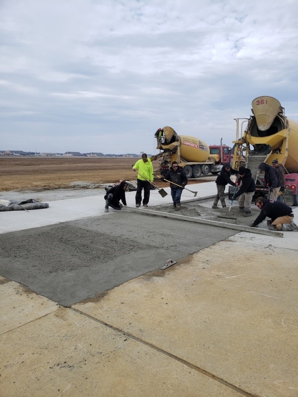 The 316th Civil Engineer Squadron provides final touches on a 6-month long taxiway repair at Joint Base Andrews, Dec. 3, 2021.