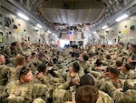 National Guard Soldiers from the Minnesota-based 34th Infantry Division pack a U.S. Air Force-operated C-17 in August 2021following the completion of their mission in Kabul, Afghanistan.