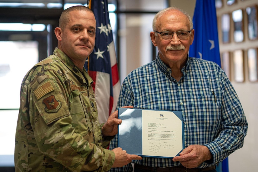 Gary Goldman accepts 50 Year Length of Service Awards and Federal Service Pin