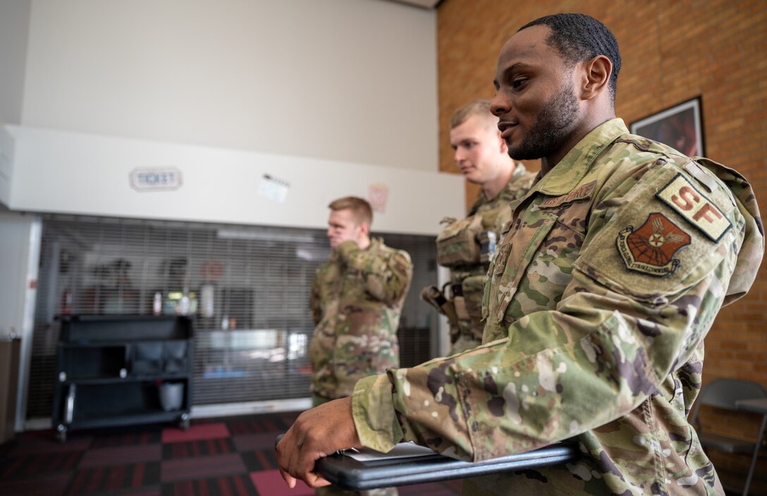 Staff Sgt. Dameion Morris, 28th Security Forces Squadron kennel master, assesses a military working dog (MWD) handler certification at Ellsworth Air Force Base, S.D., March 7, 2022.