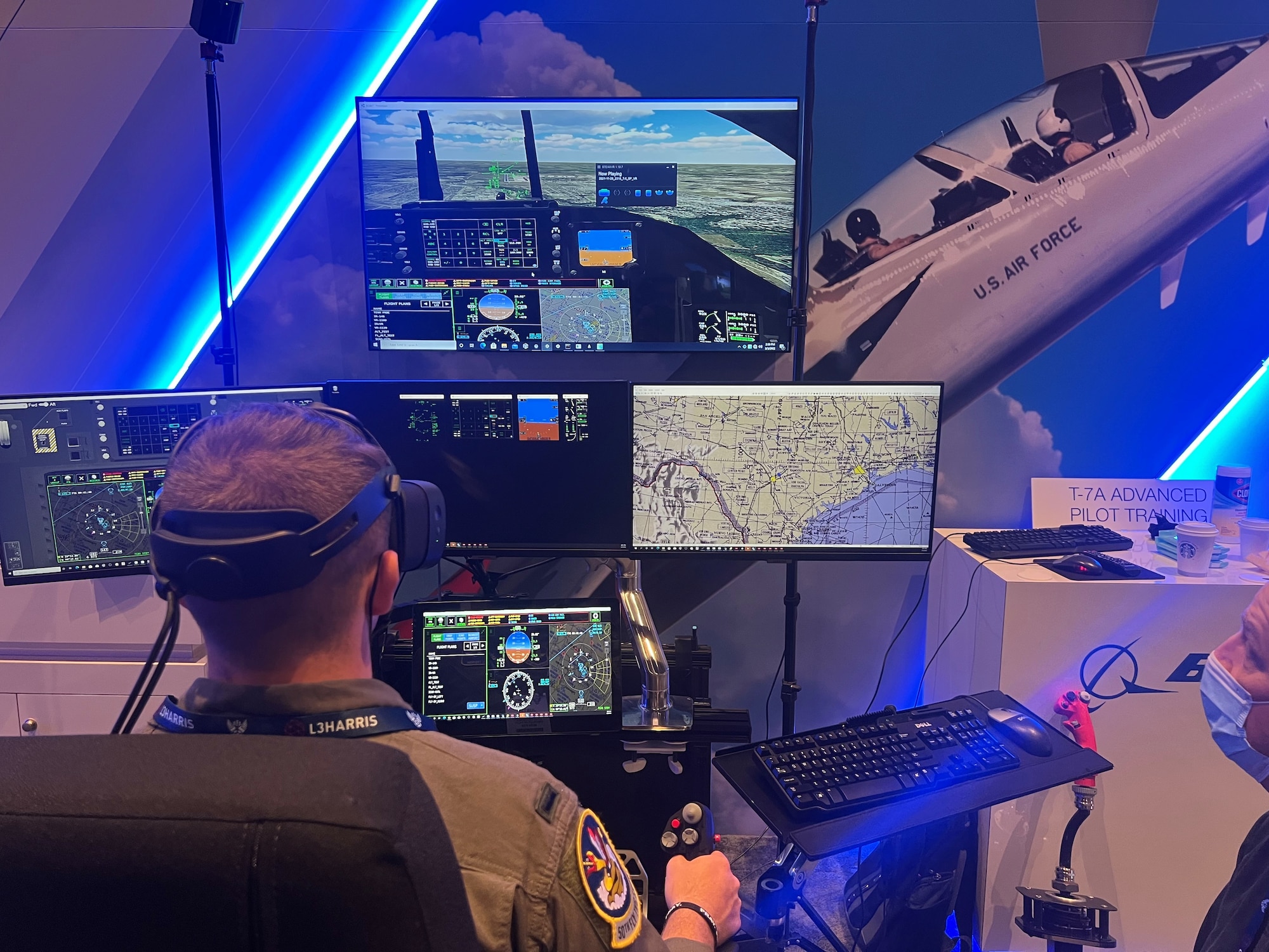 U.S Air Force 1st Lieutenant Justin Treinish, 50th Flying Training Squadron T-38 Instructor Pilot, flies in the T-7A flight simulator, March 3, 2022, at the AFA Warfare Symposium in Orlando, Florida. (U.S. Air Force photo by 2nd Lieutenant Peyton Craven)