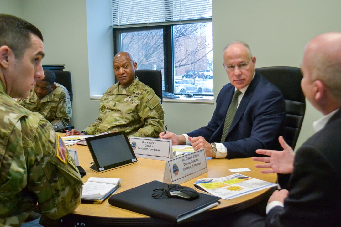 Sgt. Maj. Jimmy Sellers, Army Headquarters G-4 Deputy Chief of Staff, second from left, discusses Army uniforms and physical training gear with members of the DLA Troop Support Clothing and Textile supply chain during his visit March 9, 2022. Sellers met with members of all four supply chains, as well as the Troop Support commander and his staff, to get a better understanding of the organization’s mission.