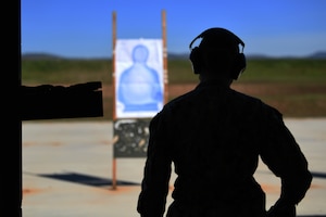 Master-at-Arms 2nd Class Jordan McGee, VQ-3 Detachment, prepares to fire the M18 modular handgun system Feb. 28, 2022, at Beale Air Force Base, California.