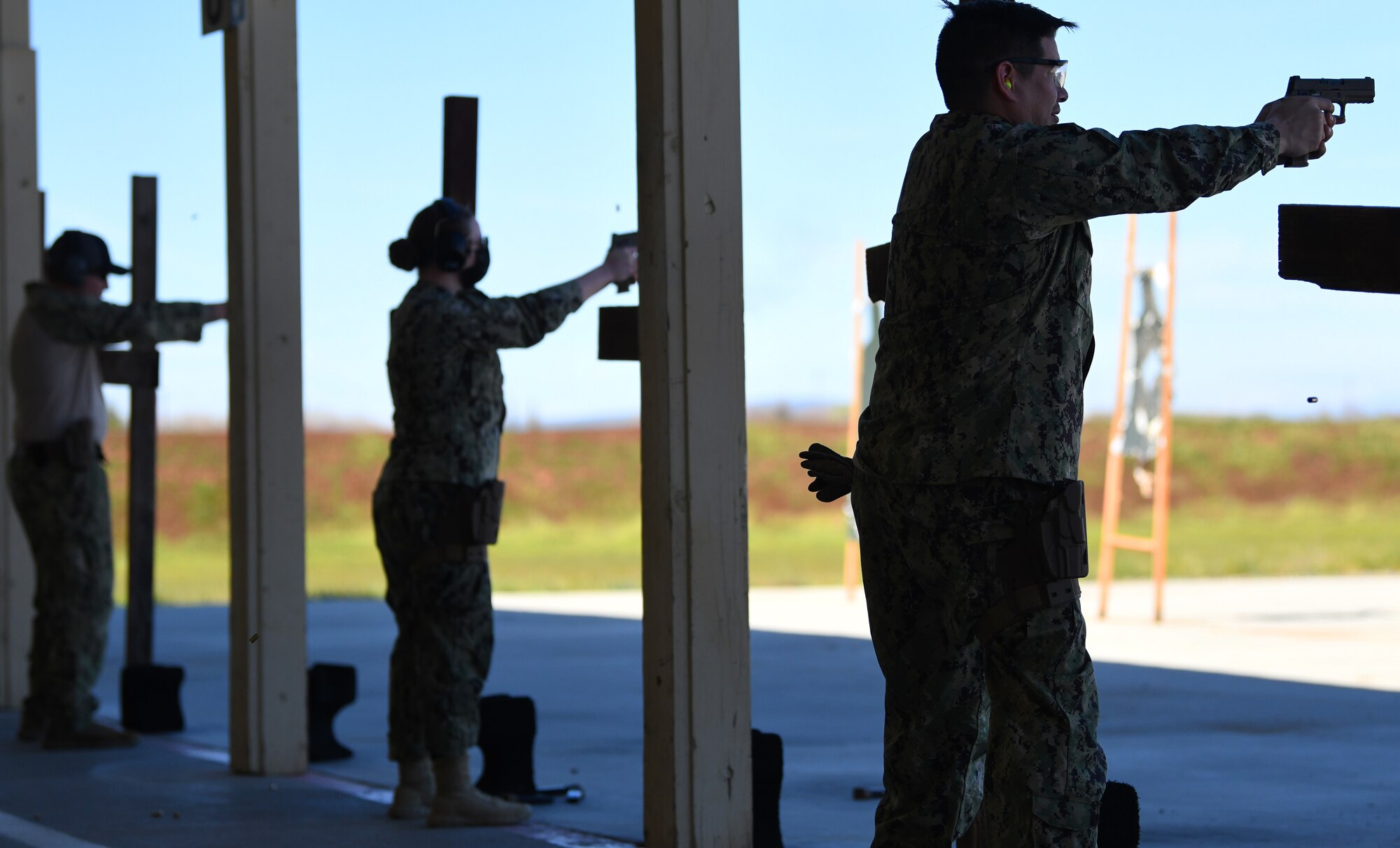 VQ-3 Detachment Sailors stationed at Travis Air Force Base fire the M18 modular handgun system Feb. 28, 2022, at Beale Air Force Base, California.
