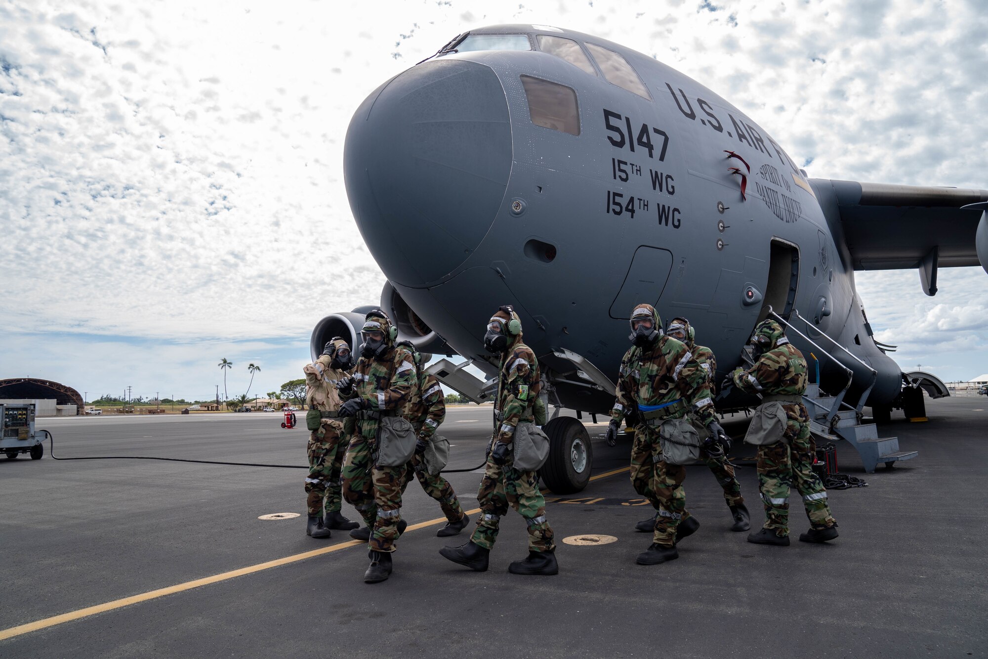 Protective Posture response level 4 during Exercise TROPIC FURY at Joint Base Pearl Harbor-Hickam, Hawaii, March 8, 2022. MOPP gear protects against chemical agents during chemical, biological and nuclear scenarios and protects Airmen from harmful substances. (U.S. Air Force photo by Airman 1st Class Makensie Cooper)