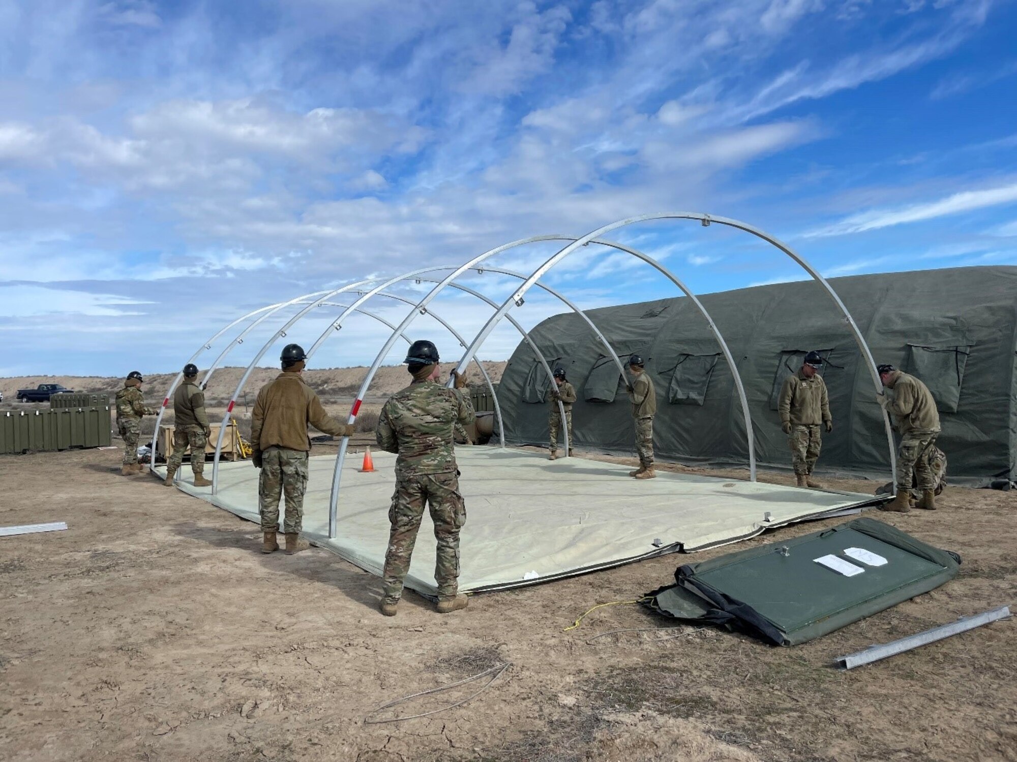 people setting up a tent