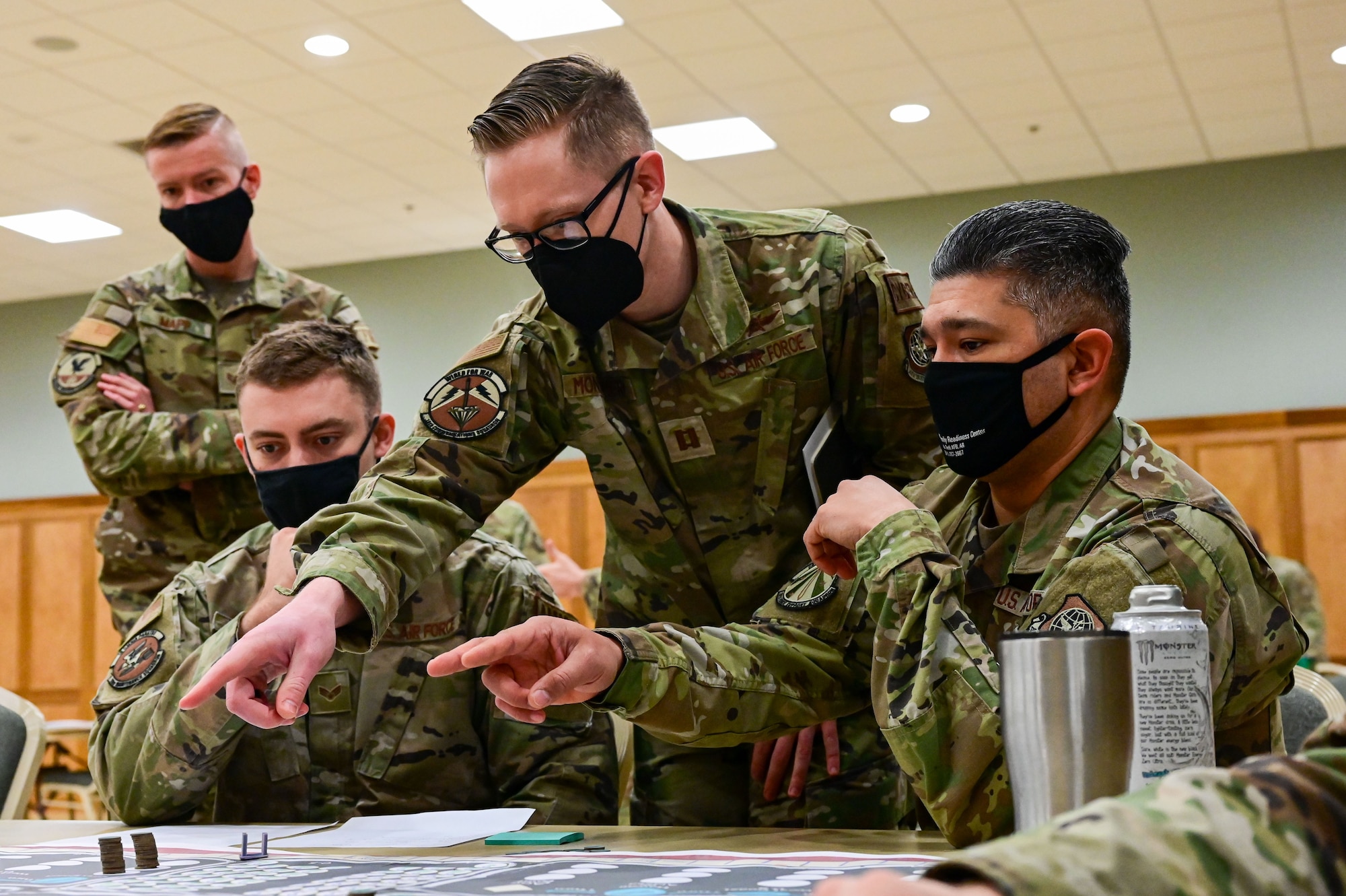 Airmen assigned to the 19th Airlift Wing strategize their next move during the KingFish Agile Combat Employment exercise