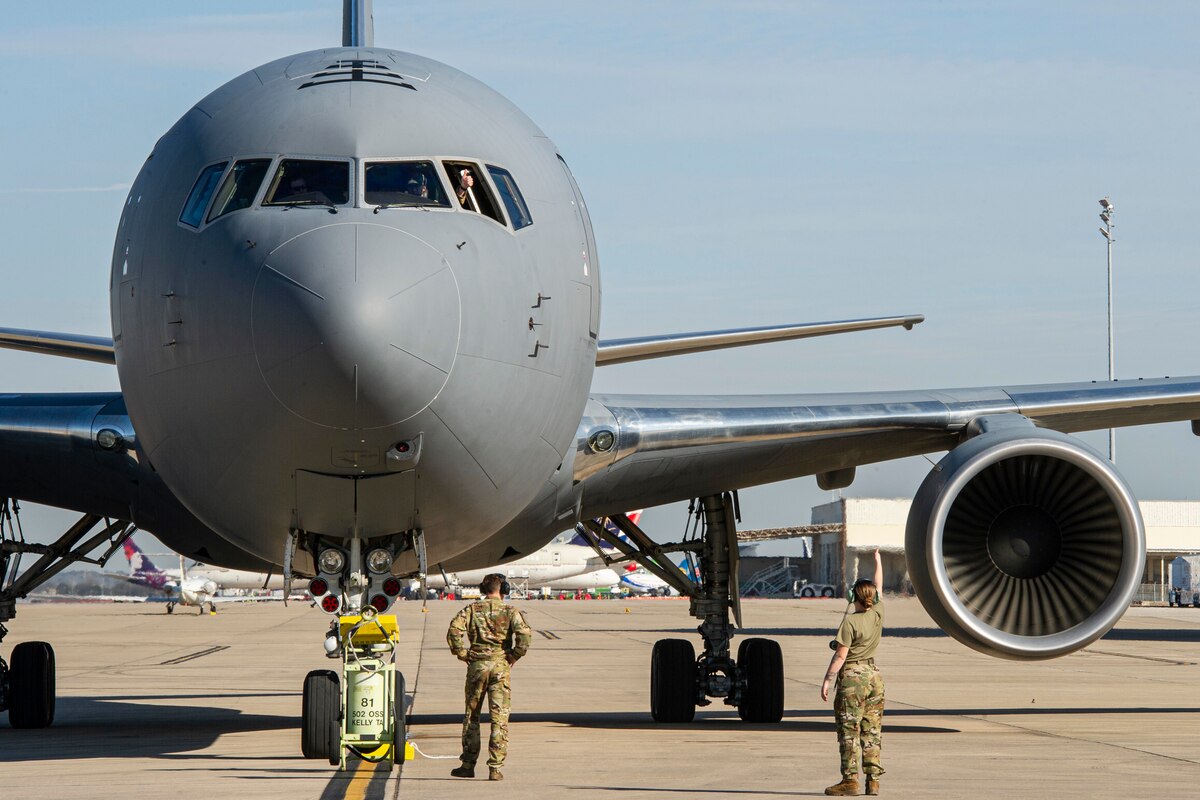 Members of the 433rd Airlift Wing Operations Support Squadron marshal in a KC-46 Pegasus transport aircraft Mar 3, 2022 at Kelly Air Field during Ultimate Caduceus 22.  Ultimate Caduceus is an annual patient movement exercise which assesses the capabilities of and provides field training to aeromedical evacuation teams, critical care air transport teams, medical staging functions and reception and onward movement functions for global patient movement.