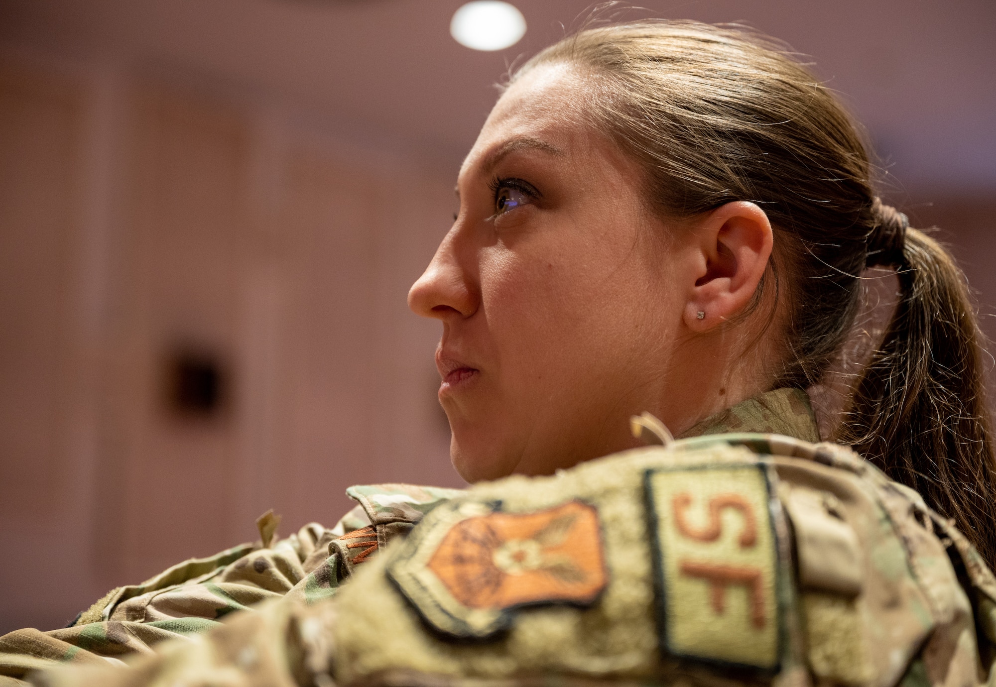 Tech. Sgt. Kellie Sawn, 28th Security Forces Squadron unit deployment manager, listens to a guest speaker’s lecture during a Women’s Conference at Ellsworth Air Force Base, S.D., March 2, 2022.