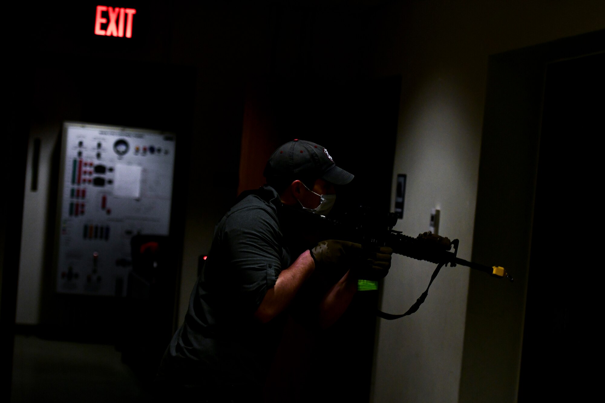 An Airman scans a building during training.