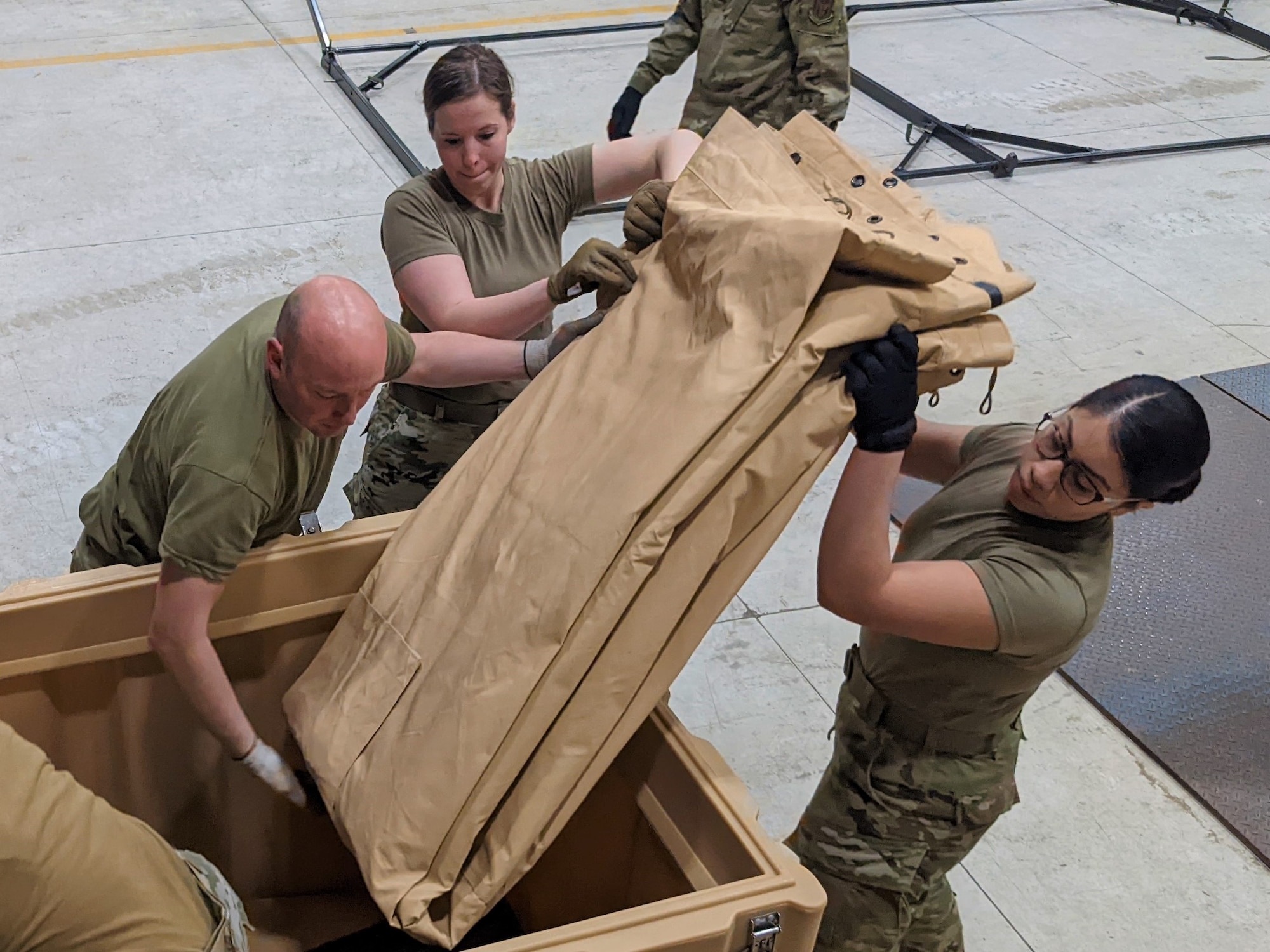 Airmen from the 419th Force Support Squadron prepare to build a tent kitchen as part of the 2022 John L. Hennessy Award competition
