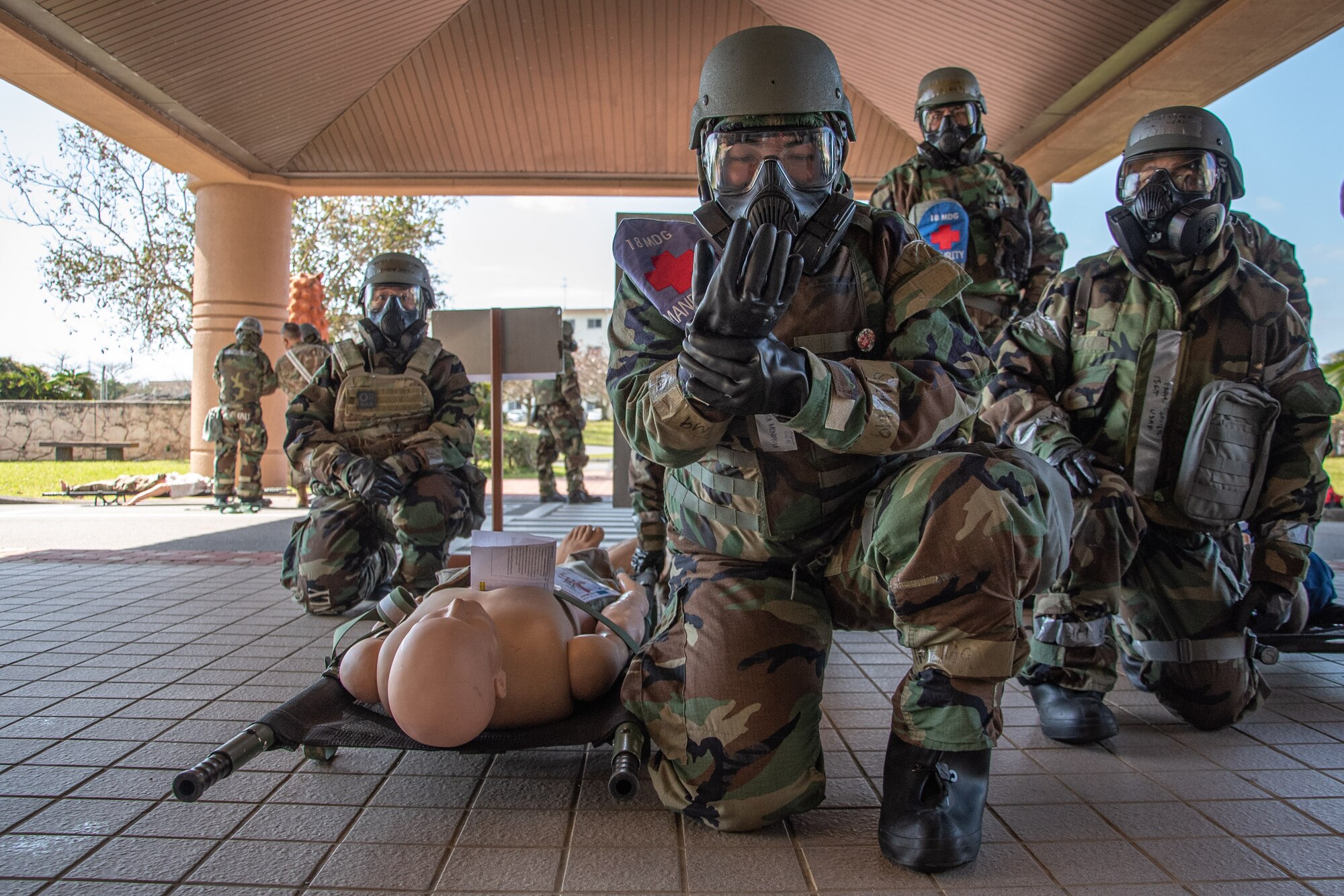 Airman prepares to carry fake patient.
