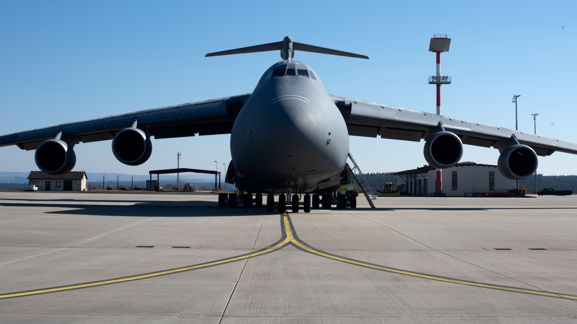A U.S. Air Force C-5M Super Galaxy aircraft from Dover Air Force Base, Delaware, awaits departure at Spangdahlem Air Base, Germany, Mar. 7, 2022.