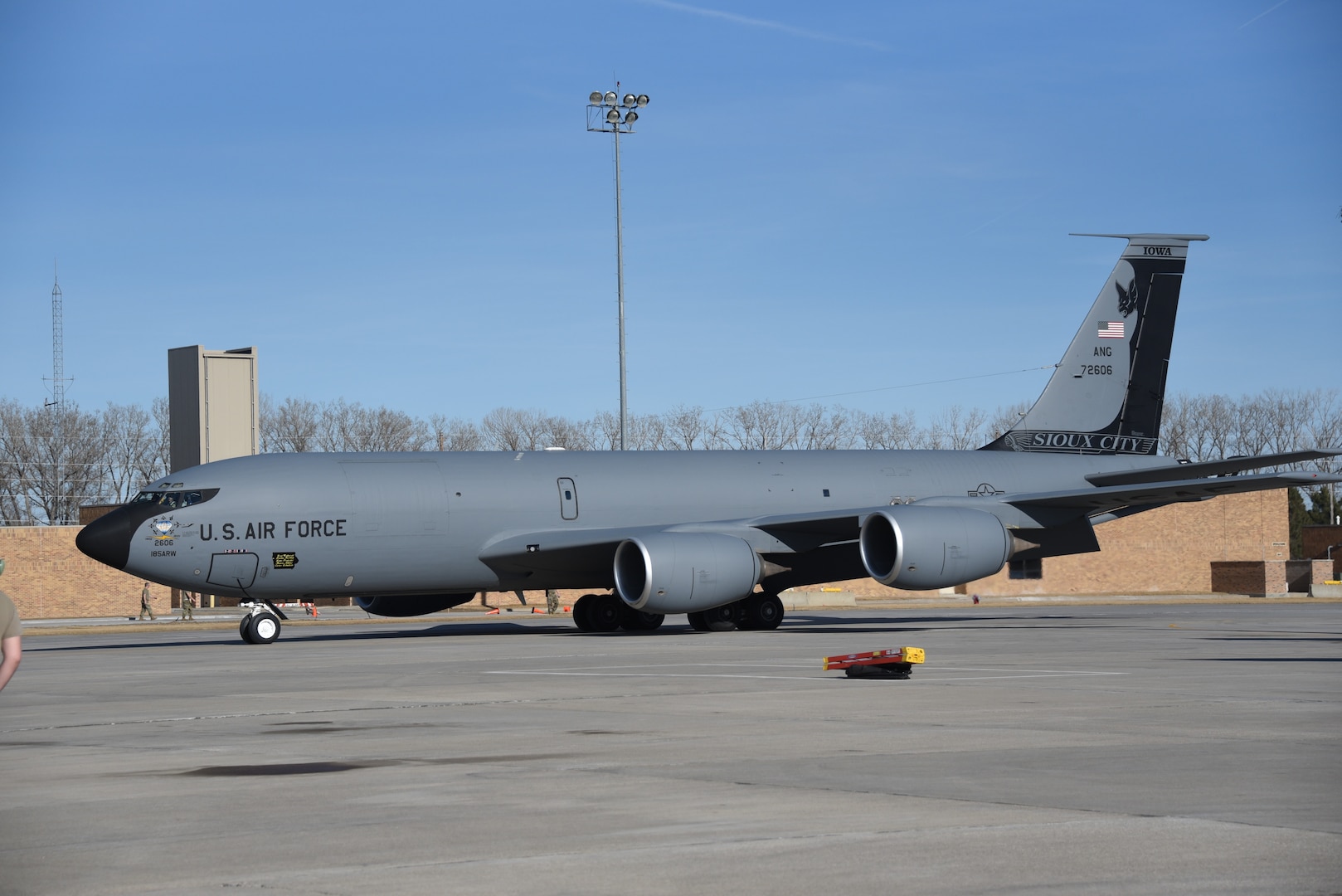 A U.S. Air Force KC-135 with 75th anniversary markings, including a large bat tail flash, tail number 57-2606 from the Iowa Air National Guard, taxis on the ramp at the 185th Air Refueling Wing in Sioux City, Iowa, March 1, 2022. The aircraft is due to be decommissioned and sent to the Aerospace Maintenance and Regeneration Group at Davis-Monthan Air Force Base.
