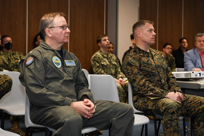 Rear Adm. Jeff Spivey, director of the Maritime Partnership Program for U.S. Naval Forces Europe-Africa/ U.S. Sixth Fleet, left, observes a crisis-response conference for exercise African Lion 2022 (AL22), March 11, 2022.