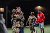 FORT KNOX, Ky. - A V Corps Soldier says goodbye to her Family prior to deployment to Germany, March 7. The V Corps main headquarters will deploy to provide additional command and control of U.S. Army forces in Europe. (U.S. Army Photo by Renee Rhodes)