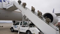 LOUISVILLE, Ky. – V Corps Soldiers board an airplane at the Louisville International Airport, March 7. The deployment of the V Corps main to Germany provides a more robust presence in theater to focus on synchronizing U.S. Army and allied nation tactical formations operating in Europe. (Courtesy Photo)