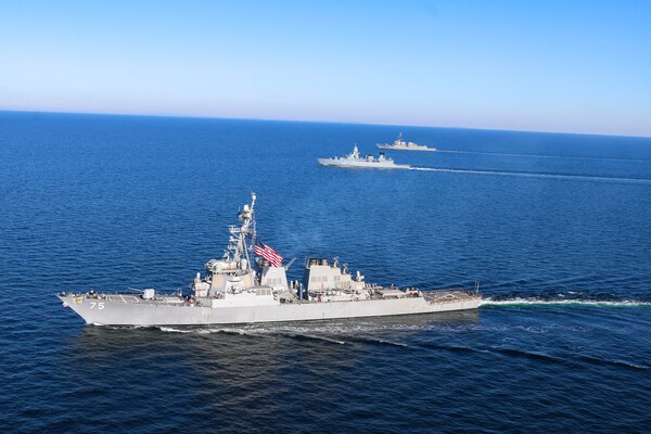 USS Forrest Sherman (DDG 98) and USS Donald Cook (DDG 75) conduct maneuvering drills with the German navy air-defense frigate FGS Sachsen (F219).
