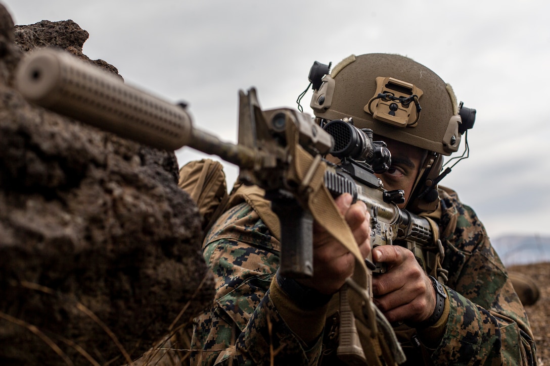 U.S. Marine Corps 2nd Lt. Sargon Bebla, a ground intelligence officer with Battalion Landing Team 1/5, 31st Marine Expeditionary Unit, observes a training area during a littoral maneuver exercise at Combined Arms Training Center Camp Fuji, Japan, March. 9, 2022. The littoral maneuver encompassed several units passing through other units' positions while moving toward an objective; these actions are the most complex evolutions a partnered force can conduct. Maritime Defense Exercise Amphibious Rapid Deployment Brigade is a bilateral exercise meant to increase interoperability and strengthen ties between U.S. and Japanese forces for the defense of Japan.