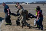 Airmen with the 181st Intelligence Wing, civilian authorities and first responders participate in a mass casualty exercise during a simulated aircraft crash at Hulman Field Air National Guard Base, Ind., March 5, 2022. The exercise was designed to test and enhance the capabilities of multiple emergency response agencies.
