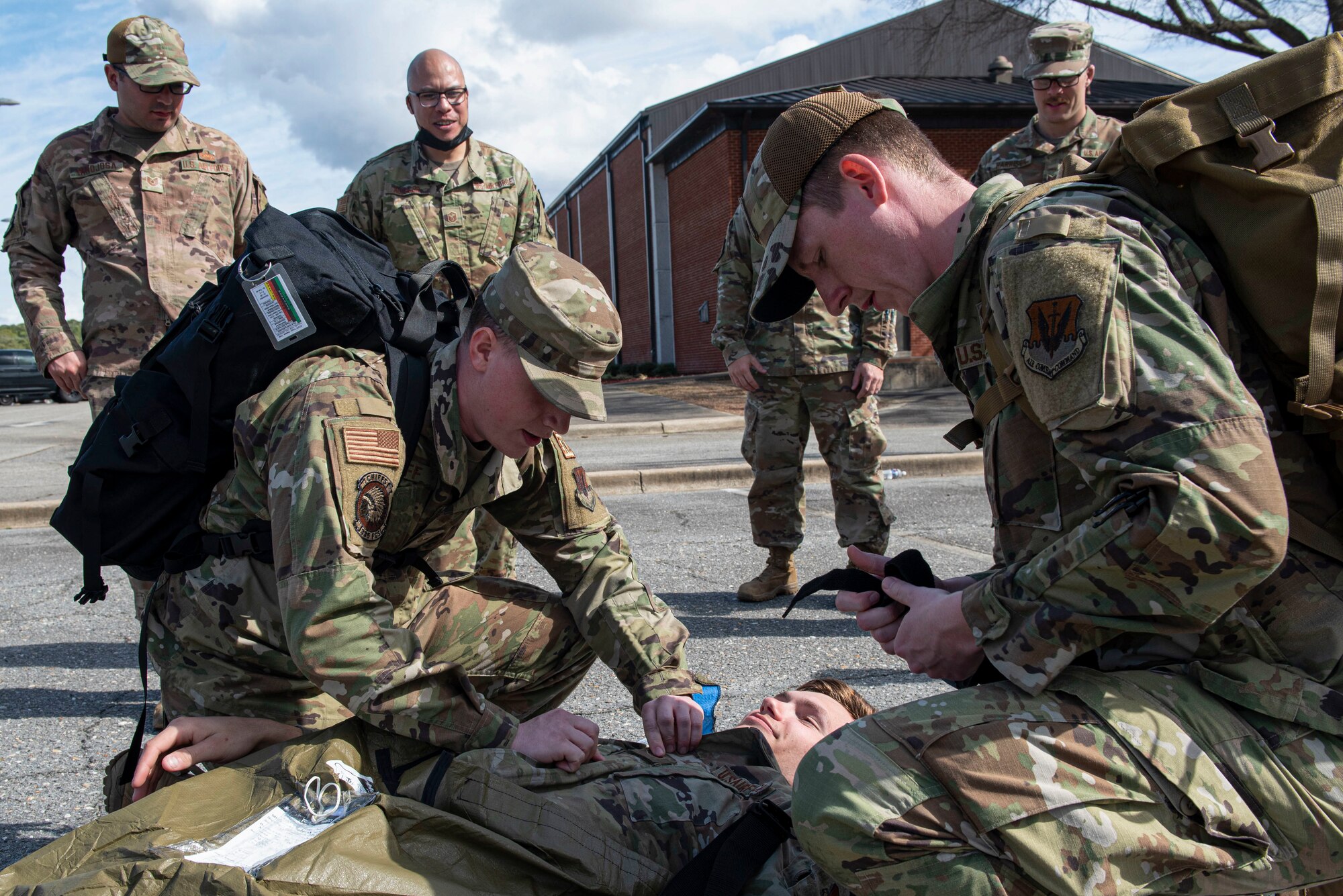 Airmen assigned to the 4th Fighter Wing participate in tactical casualty combat care training at Seymour Johnson Air Force Base, North Carolina, Feb. 18, 2022. TCCC training provides participants with skills needed to respond to and treat injured personnel during real-world scenarios. (U.S. Air Force photo by Airman 1st Class Sabrina Fuller)