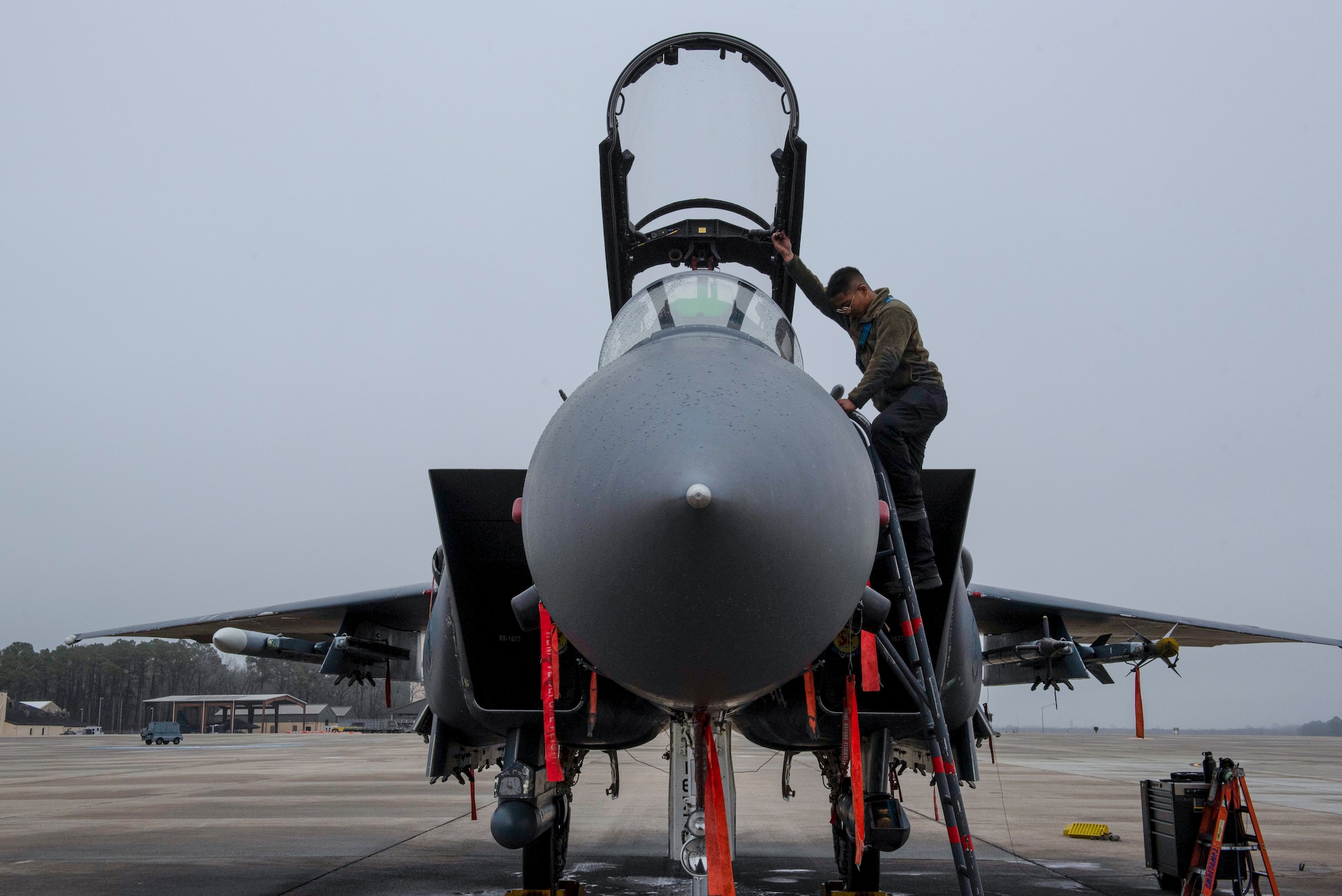 Senior Airman Jace Riveral, 334th Fighter Generation Squadron crew chief, inspects the interior of an F-15E Strike Eagle at Seymour Johnson Air Force Base, North Carolina, March 9, 2022. The F-15 has the capability to fight its way to a target over long ranges in order to destroy enemy ground positions. (U.S. Air Force photo by Airman 1st Class Sabrina Fuller)