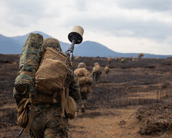 U.S. Marine Corps Cpl. Jeremy Good, a signal operator with 31st Marine Expeditionary Unit, moves toward the objective during an air assault training exercise, on Combined Arms Training Center Camp Fuji, Japan, March 9, 2022. The training exercise was conducted to build proficiency in rapidly seizing and defending key terrain. Maritime Defense Exercise Amphibious Rapid Deployment Brigade is a bilateral exercise meant to increase interoperability and strengthen ties between U.S. and Japanese forces for the defense of Japan.