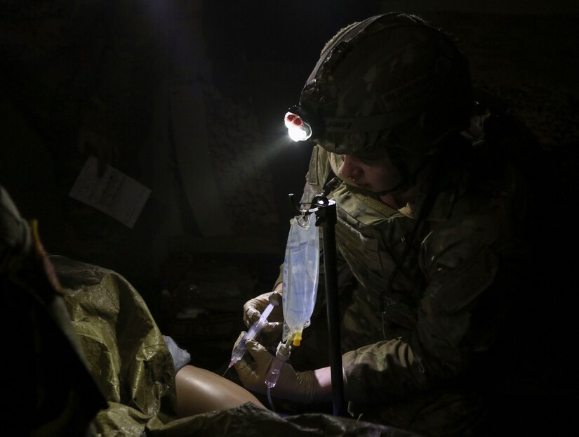 Sgt. Andrew Swartwood, a combat medic with 1st Battalion, 112th Infantry Regiment, 56th Brigade Combat Team, 28th Infantry Division, Pa. Army National Guard, treats a simulated casualty during the final evaluation event of the TC8-800 medic sustainment course March 3 at Fort Indiantown Gap, Pa. The course, which was  held Feb. 17-Mar. 3, gives the 17 participants the opportunity to train together with other medics outside their home units, without taking up time during drill weekends where most training is conducted. (U.S. Army National Guard photo by Staff Sgt. Zane Craig)