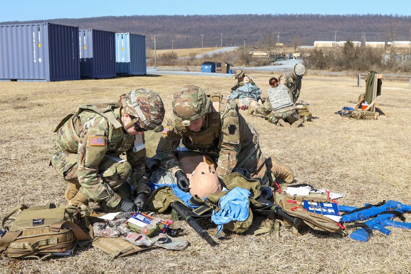 Combat medics with the Pennsylvania National Guard treat a simulated casualty as part of the TC8-800 medic sustainment course March 2 at Fort Indiantown Gap, Pa. The course, which was held Feb. 17-March 3, gave the 17 participants the opportunity to train together with other medics outside their home units, without taking up time during drill weekends where most training is conducted. (U.S. Army National Guard photo by Staff Sgt. Zane Craig)