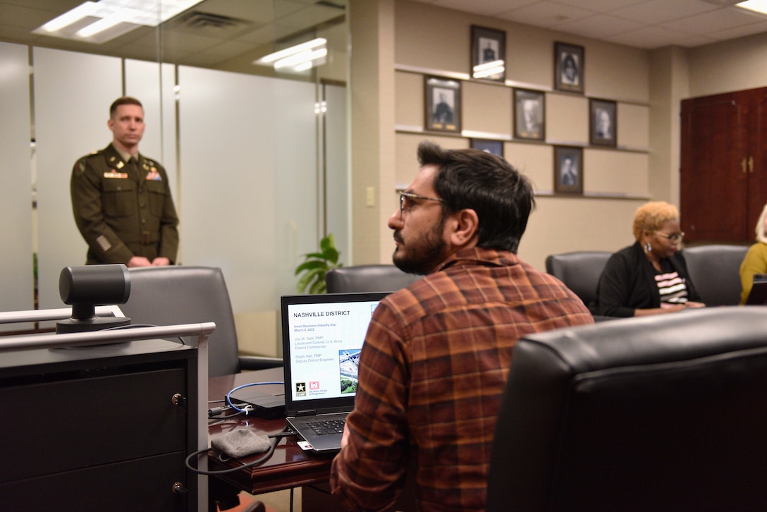 Visual Information Specialist Joseph Rini ensures all technical aspects of the virtual event run smoothly. Also pictured: LTC. Nathan Branen, LTC. Nathan Branen, deputy district commander, U.S. Army Corps of Engineers, Nashville District. (USACE Photo by HEATHER KING)