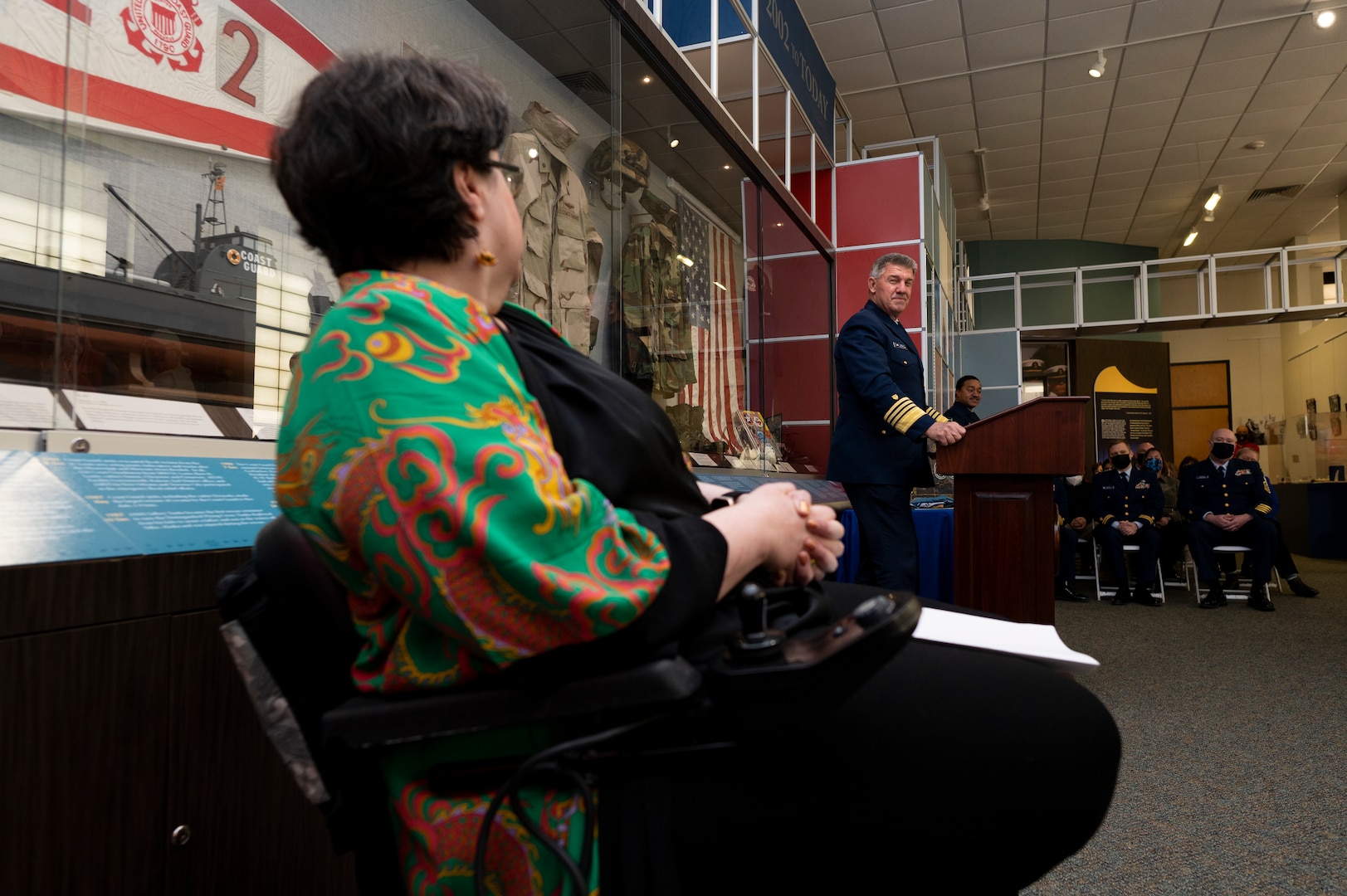 Adm. Karl Shultz, Commandant of the U.S. Coast Guard, addresses Jen Gaudio during her retirement ceremony at the Coast Guard Academy Museum, March 2.