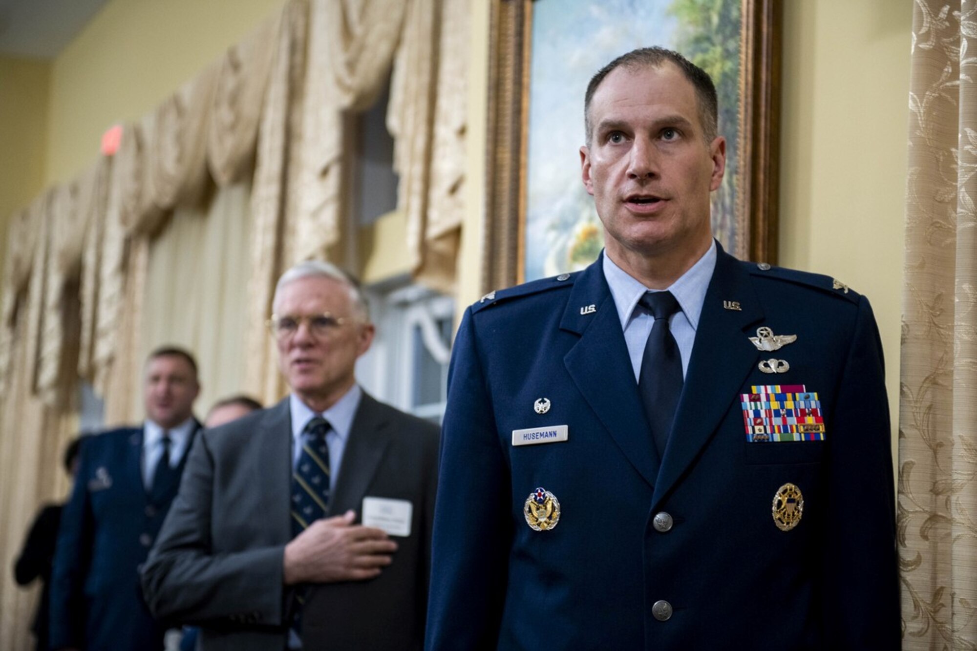 Col. Matt Husemann, 436th Airlift Wing commander, recites the pledge of allegiance during The Military Affaire in Dover, Delaware, March 10, 2022. The Central Delaware Chamber of Commerce’s Military Affairs Committee was awarded the Abilene Trophy as a way to feature the outstanding support they provide Airmen, their families and the combat airlift mission. The Abilene Trophy was established in 1999 to recognize the community that best supports an Air Mobility Command base each calendar year. The CDCC MAC has won the trophy five times. (U.S. Air Force photo by Tech. Sgt. J.D. Strong II)
