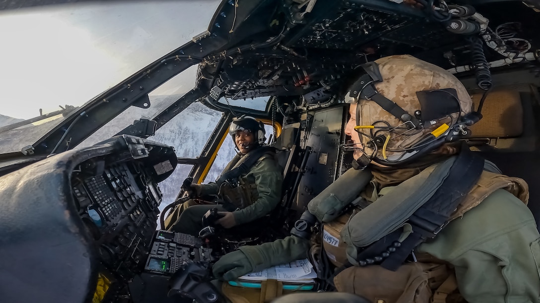U.S. Marine Corps Capt. Brittany Hartsfield and Maj. Kyliegh Cullen, pilots with Marine Heavy Helicopter Squadron 366, 2d Marine Aircraft Wing, transport Marines with 2nd Low Altitude Air Defense Battalion in a CH-53E Super Stallion, near Bardufoss Air Station, Norway, March 8, 2022. Exercise Cold Response 2022 is a biennial Norwegian national readiness and defense exercise that takes place across Norway, with participation from each of its military services, as well as from 26 additional North Atlantic Treaty Organization allied nations and regional partners. (U.S. Marine Corps photo by Lance Cpl. Christian Cortez)