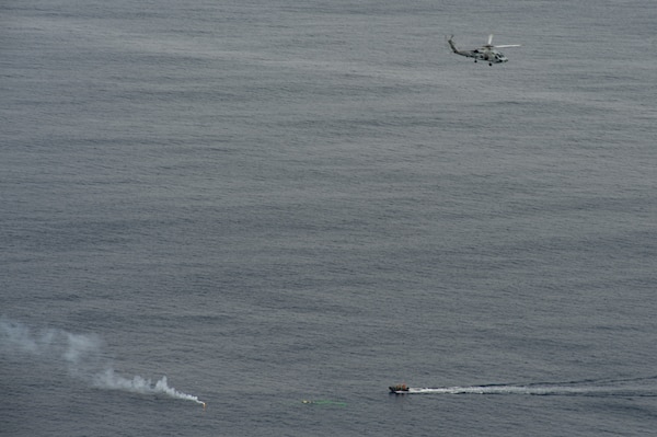 TOKYO BAY (March 10, 2022) A small boat team from Japan Maritime Self-Defense Force (JMSDF) Utility Landing Ship JS Yusotei 2-go (LCU 2002) retrieve a torpedo following the first torpedo exercise conducted by a U.S. Navy squadron alongside the JMSDF. HSM-77 is attached to Commander, Task Force 70 and forward-deployed to the U.S. 7th Fleet area of operations in support of a free and open Indo-Pacific. (U.S. Navy photo by Mass Communication Specialist 2nd Class Askia Collins)