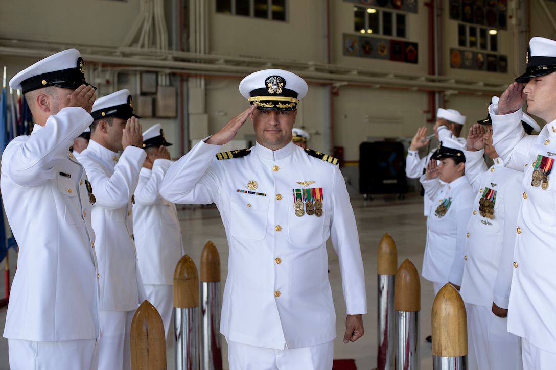 U.S. Navy Cmdr. Matthew Martin, off-going commanding officer, Helicopter Maritime Strike Squadron 37, salutes during the HSM-37 change of command ceremony, Marine Corps Air Station Kaneohe Bay, Marine Corps Base Hawaii, March 3, 2022. Cmdr. Matthew Martin relinquished command to Cmdr. Allen Jacob. (U.S. Marine Corps photo by Cpl. Samantha Sanchez)