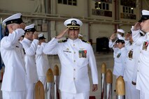 U.S. Navy Cmdr. Matthew Martin, off-going commanding officer, Helicopter Maritime Strike Squadron 37, salutes during the HSM-37 change of command ceremony, Marine Corps Air Station Kaneohe Bay, Marine Corps Base Hawaii, March 3, 2022. Cmdr. Matthew Martin relinquished command to Cmdr. Allen Jacob. (U.S. Marine Corps photo by Cpl. Samantha Sanchez)