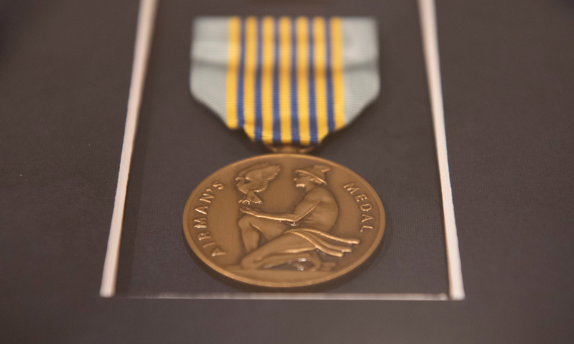 An Airman’s Medal rests prior to the ceremony for U.S. Air Force Capt. Christopher J.J. Adams at Moody Air Force Base, Georgia, March 11, 2022. Airman’s Medals are presented to military members who have distinguished themselves through heroic acts. (U.S. Air Force photo by Senior Airman Thomas Johns)