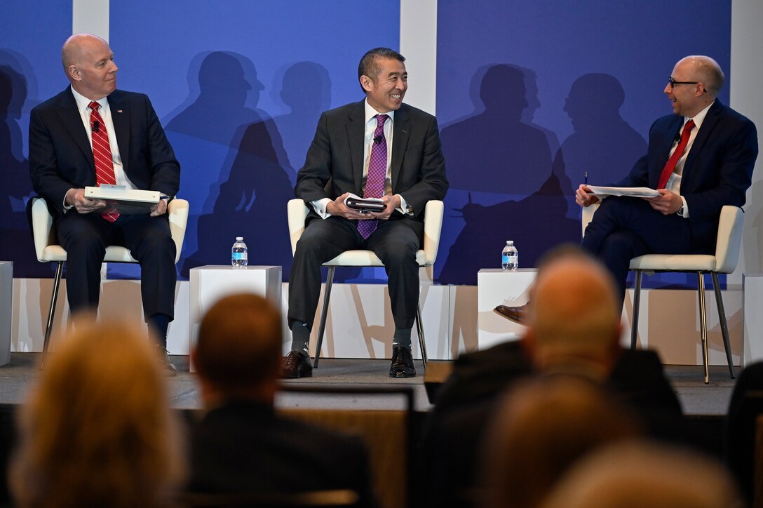 Edwin Oshiba, center, acting secretary of the Air Force for energy, installations, and environment, speaks during a panel discussion for the 2022 Association of Defense Communities National Summit in Arlington, Va., March 8, 2022. Oshiba spoke about the priorities and challenges for Air Force installations. (U.S. Air Force photo by Eric Dietrich)